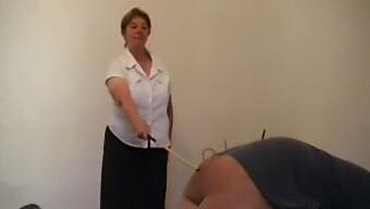 Elderly Woman Punishes Man With Cane In Bdsm Scene